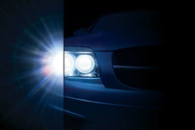 An image of the headlights of a car.